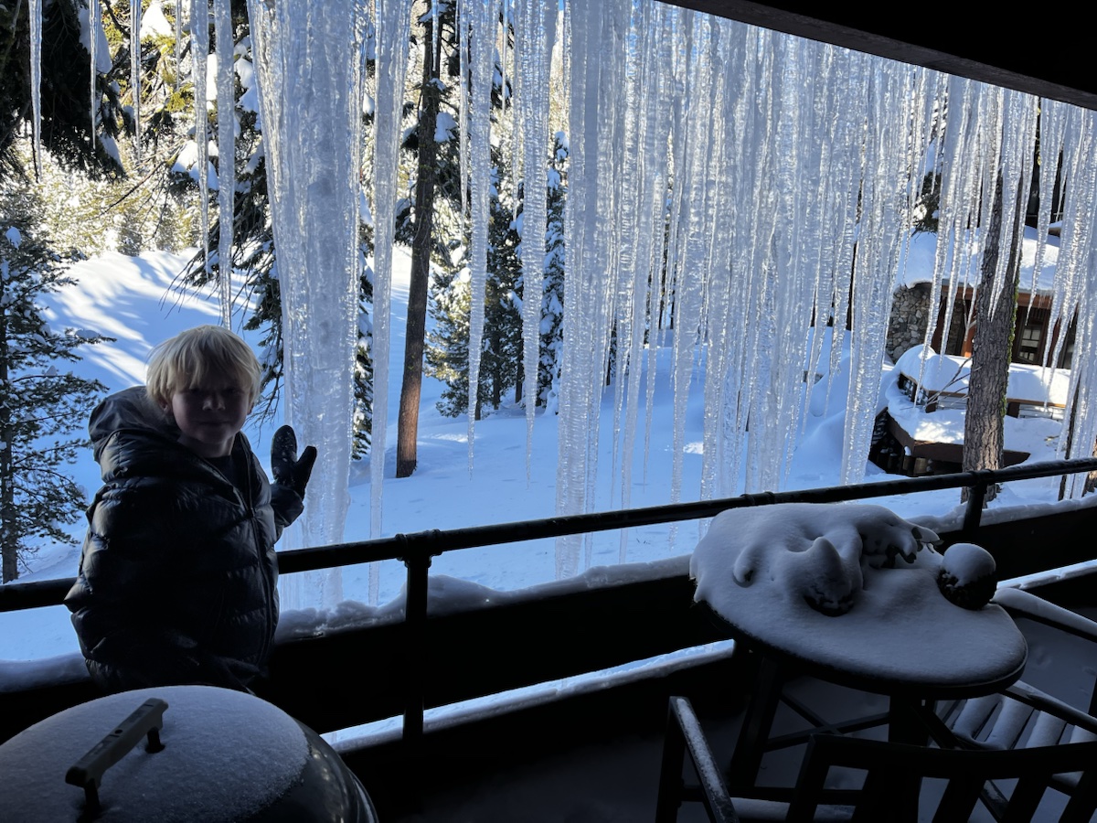 Long winter icicles hanging beside the chalet